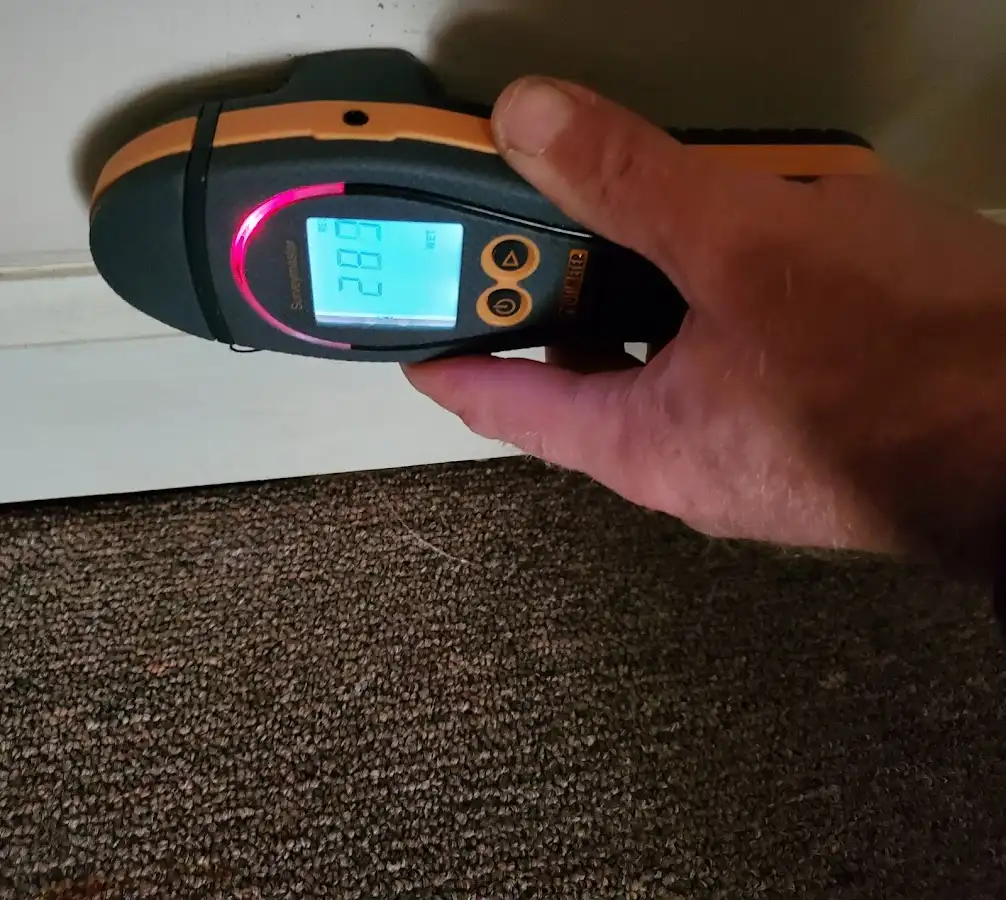 Moisture detection at baseboard during Storm Damage Restoration in Dahlonega